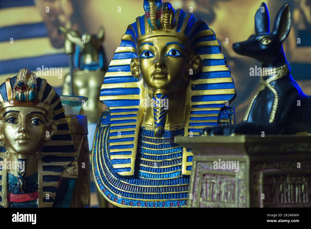 Still life of statues of king pharaoh tutankhamun tutankhamen and mythology jackal anup in blue Stock Photo