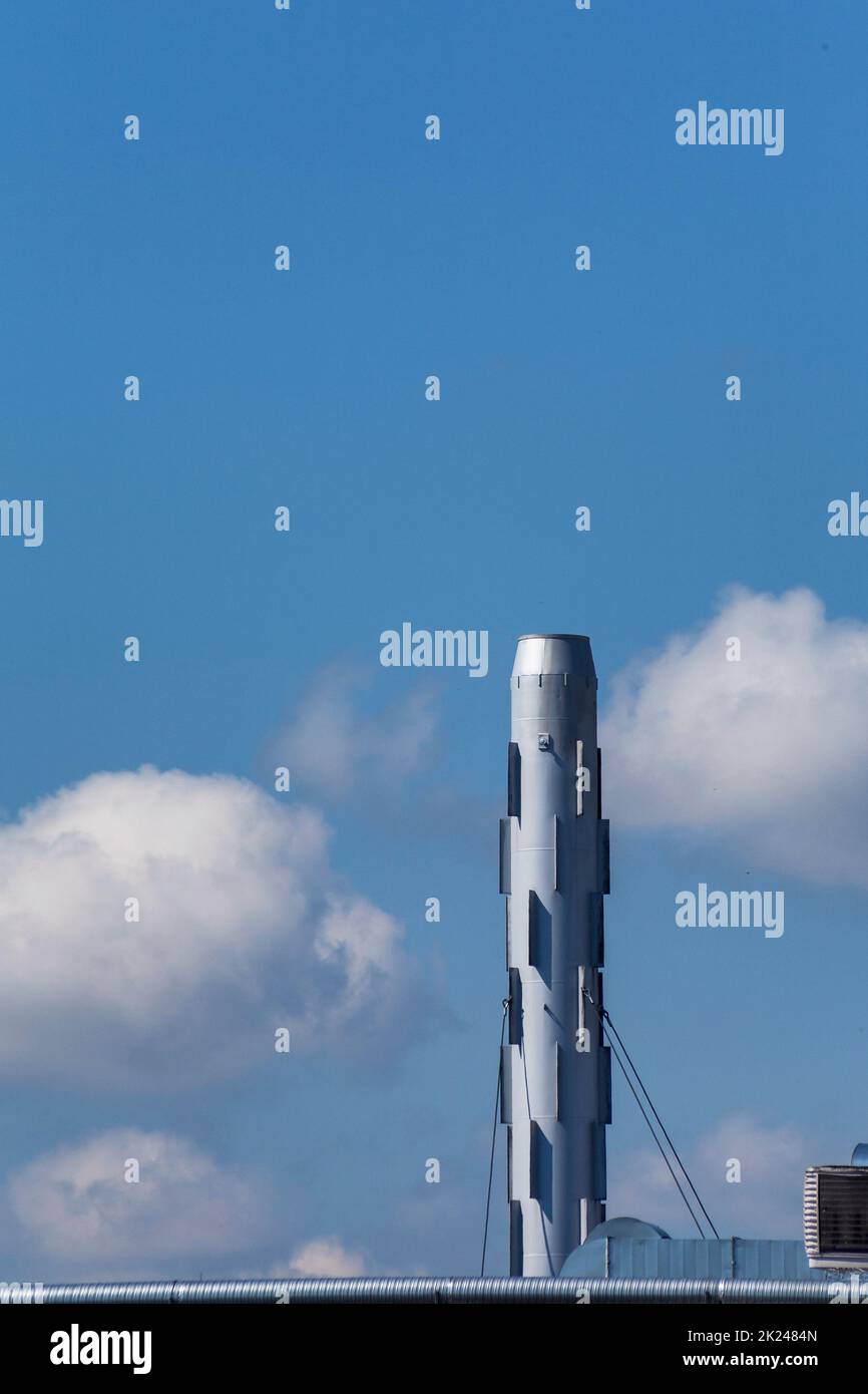 Exhaust pipe system against blue sky. Pire is not in function. Stock Photo