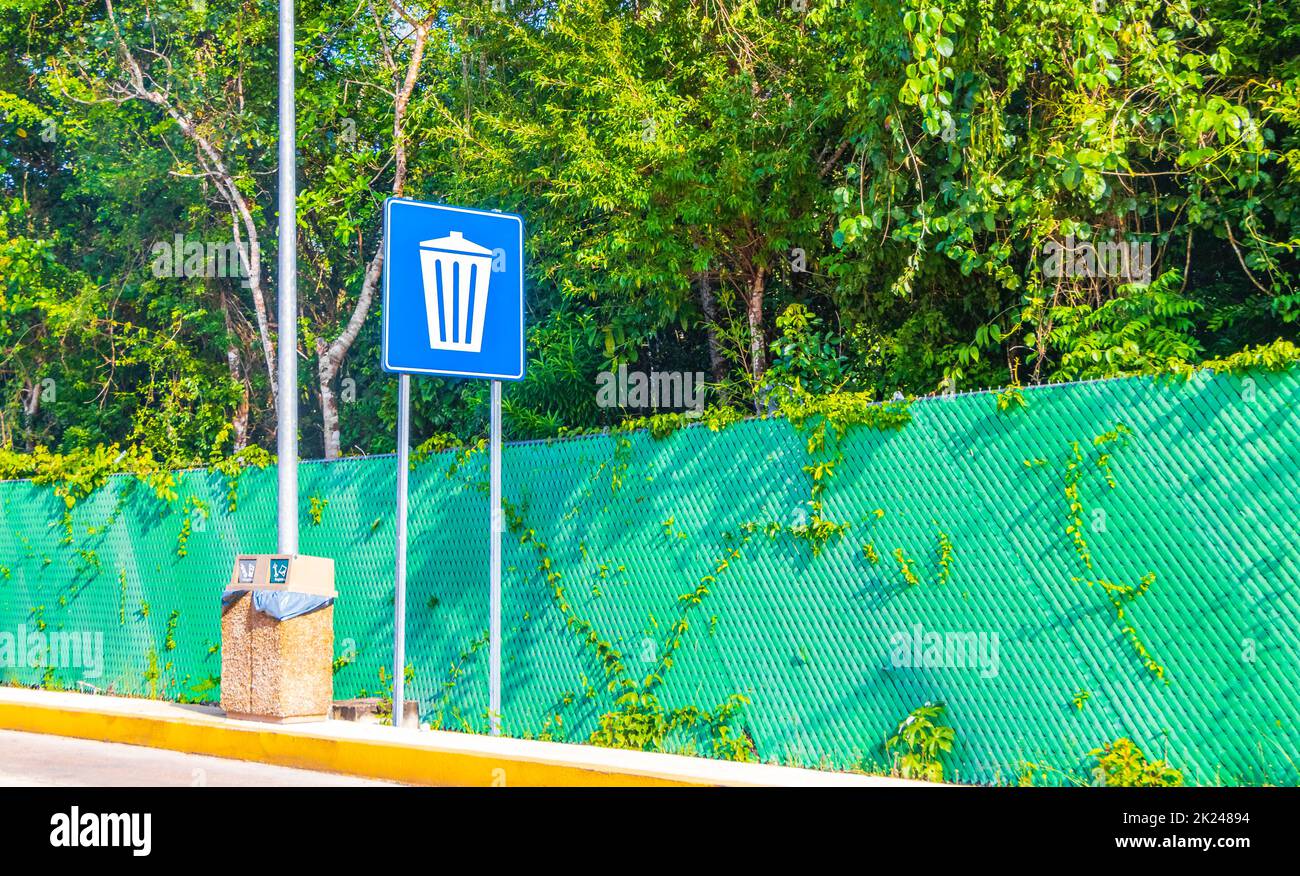 Blue garbage trash sign at the highway in the jungle and tropical