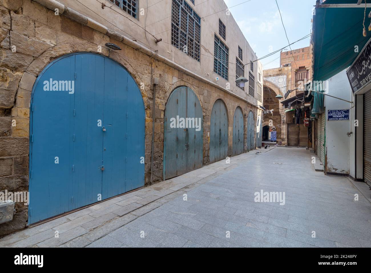 Alley at old historic Mamluk era Khan al-Khalili famous bazaar and souq, with closed shops during Covid-19 lockdown, Cairo, Egypt Stock Photo