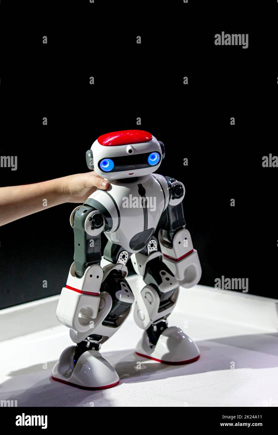 The  model robot in the hands of a child at the exhibition Stock Photo