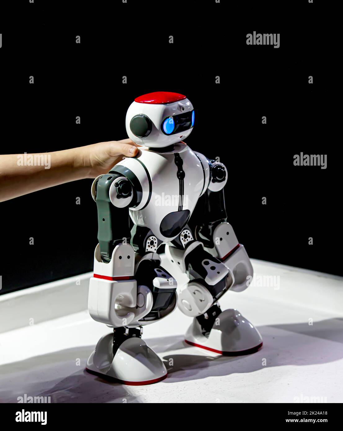 The  model robot in the hands of a child at the exhibition Stock Photo