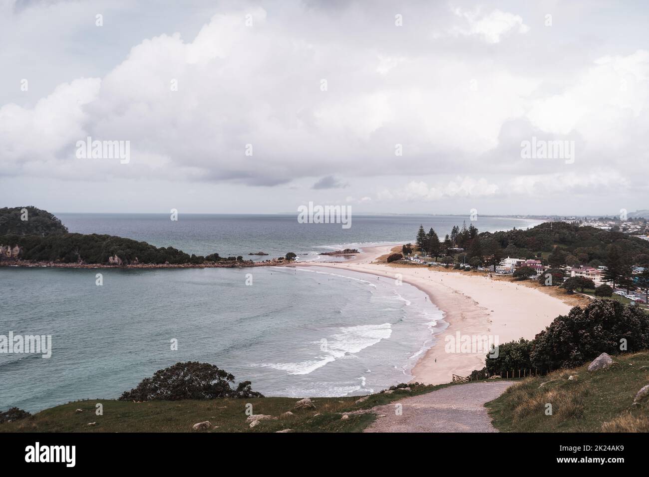 white sand beach under a cloudy sky Stock Photo - Alamy