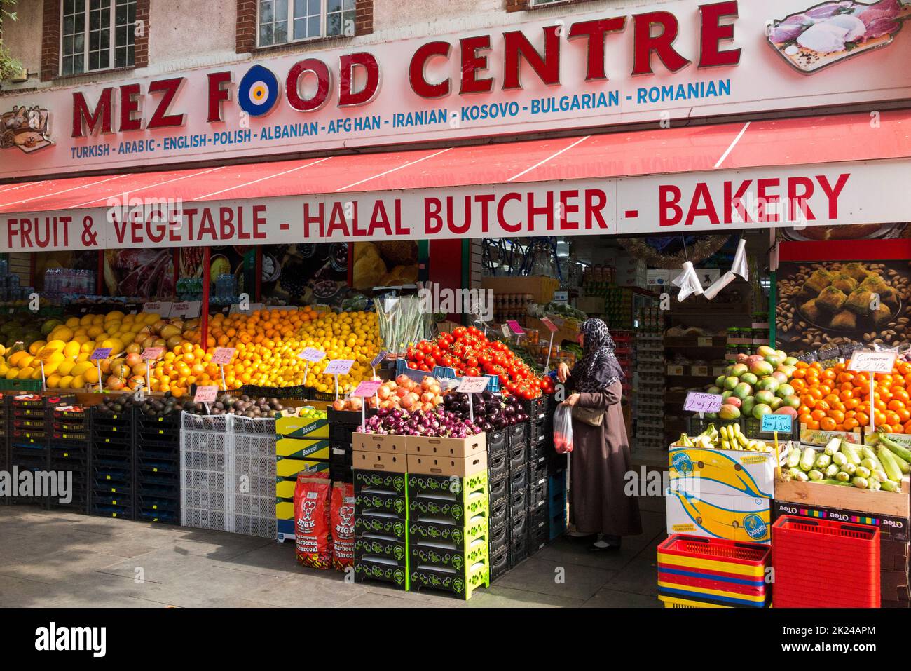 Mez Food centre Greenford, Greenford Rd, Greenford, is a fruit and vegetable Green grocer food shop, and also a halal butcher and bakery, supplying and selling Arabic, English, Polish, Albanian, Afghan, Iranian, Kosovan, Bulgarian and Romanian foods. (132) Stock Photo