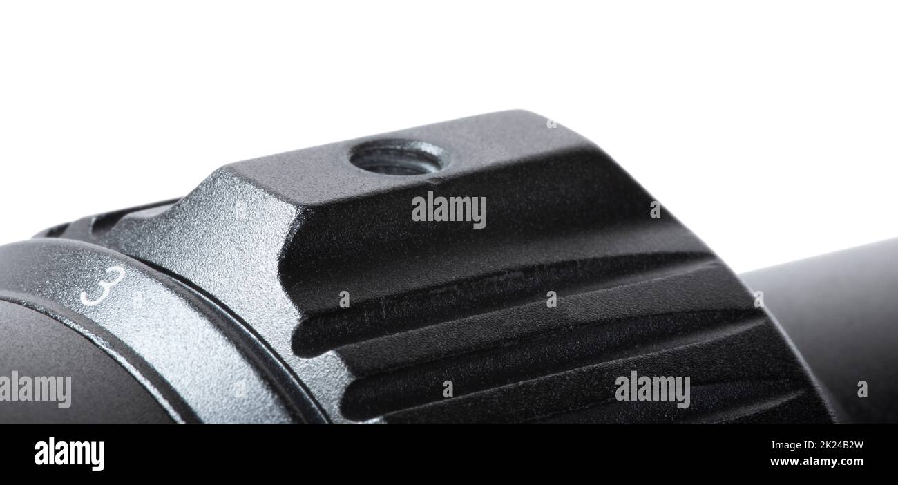 Magnification ring on a rifle scope with a speed bump isolated on white