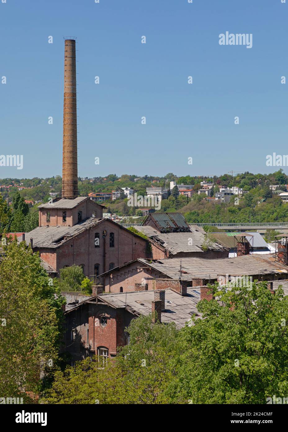 Big Brick Chimney at Abandoned Factory Building Complex Stock Photo
