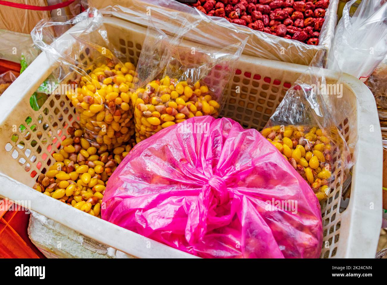 Sweeten Ginkgo Biloba natural seed Ginkgo flavoneglycosides Thai food Chinese cuisine in street food market in China Town Bangkok Thailand. Stock Photo