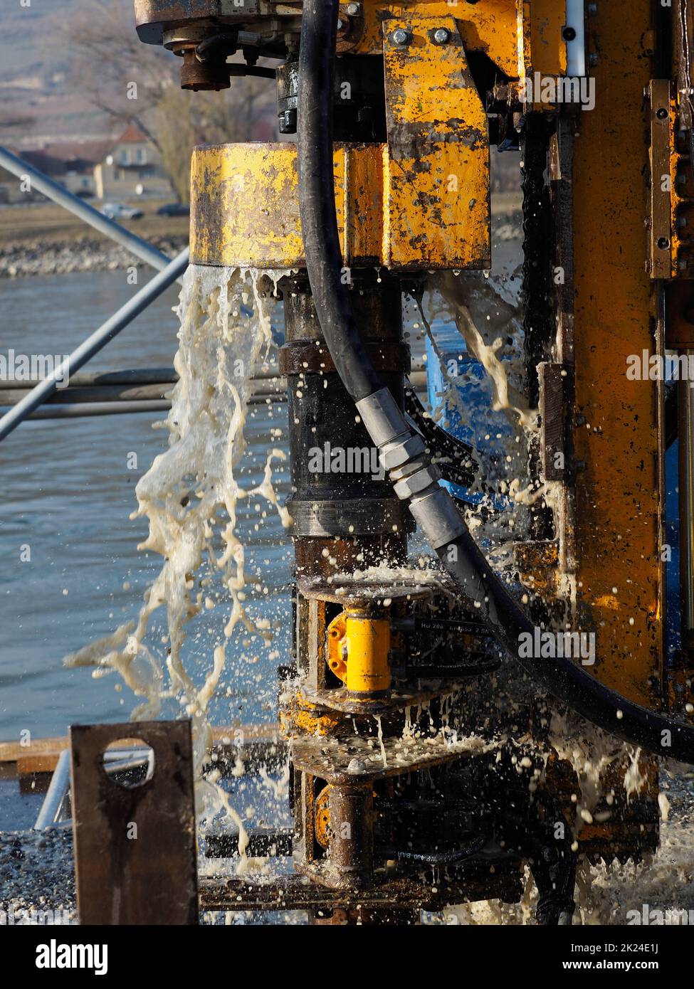 Working with a small bored pile drill rig on the water. Stock Photo