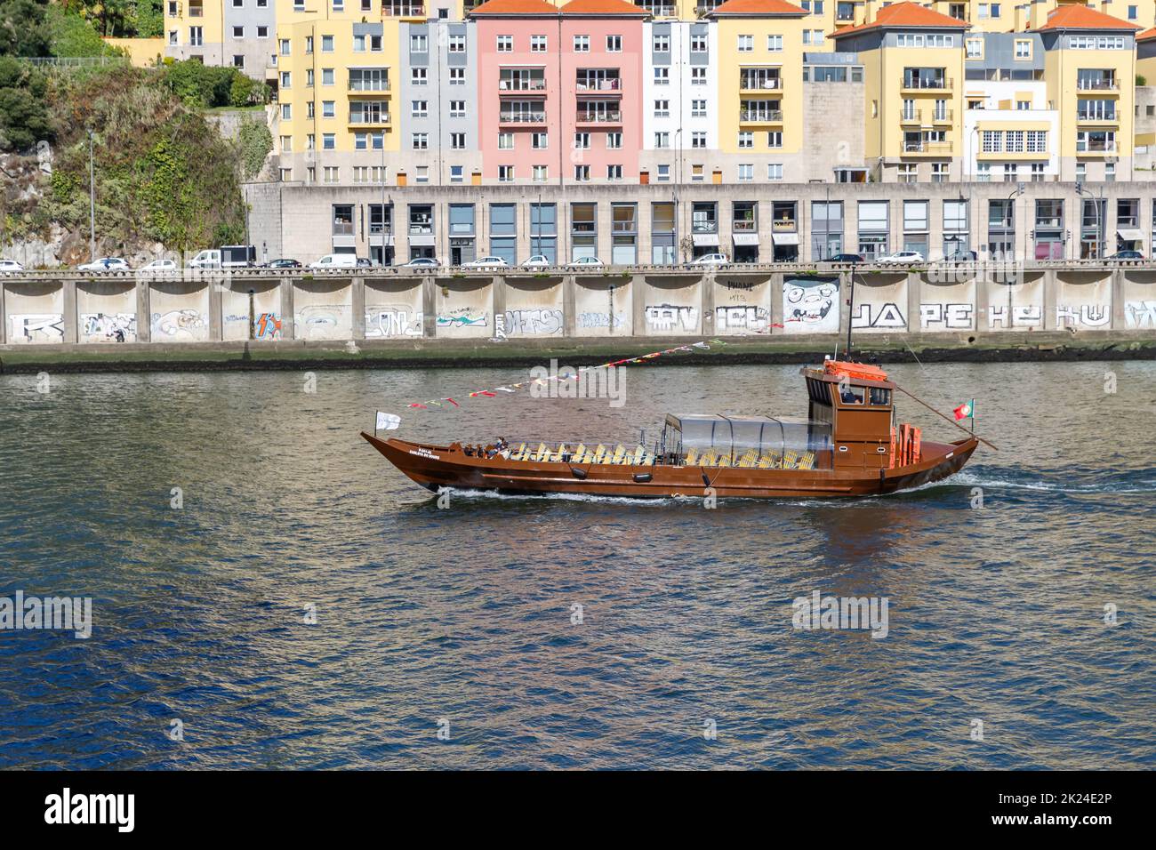 Porto, Portugal - October 23, 2020: Carlota do Douro tourist transport boat sailing on the Douro river showing the ancient city to visitors on an autu Stock Photo