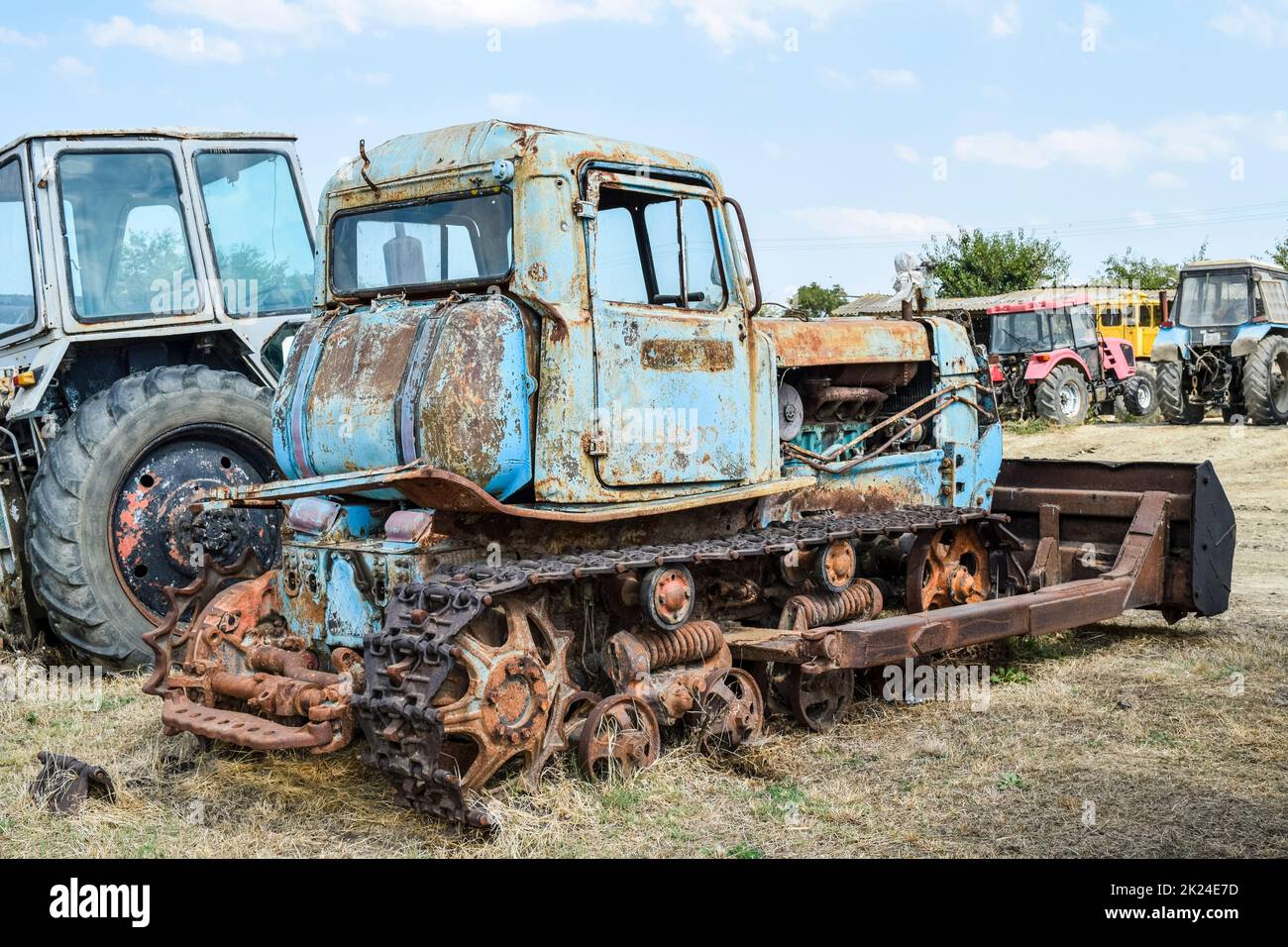 Old rusty disassembled tractor. tractor Agricultural machinery Stock Photo