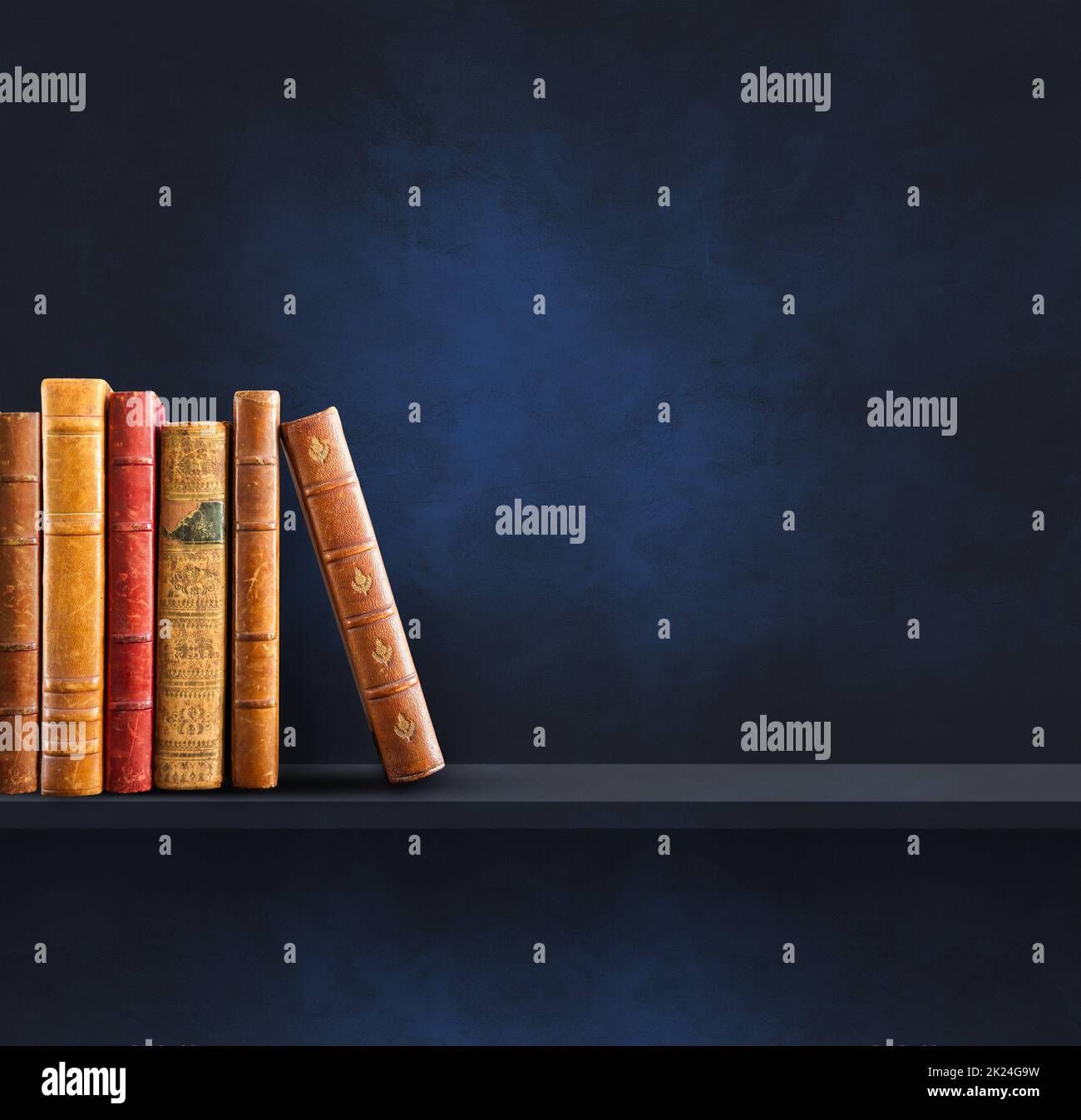 Row of old books on black shelf. Square scene background Stock Photo ...