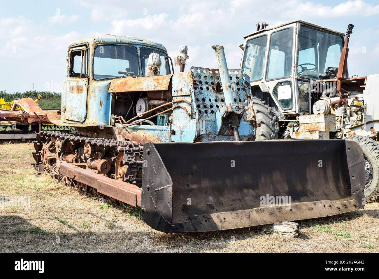 Tractor. Agricultural machinery tractor. tractor with pick-up, grader. Parking of tractor agricultural machinery. The picture was taken at a parking l Stock Photo