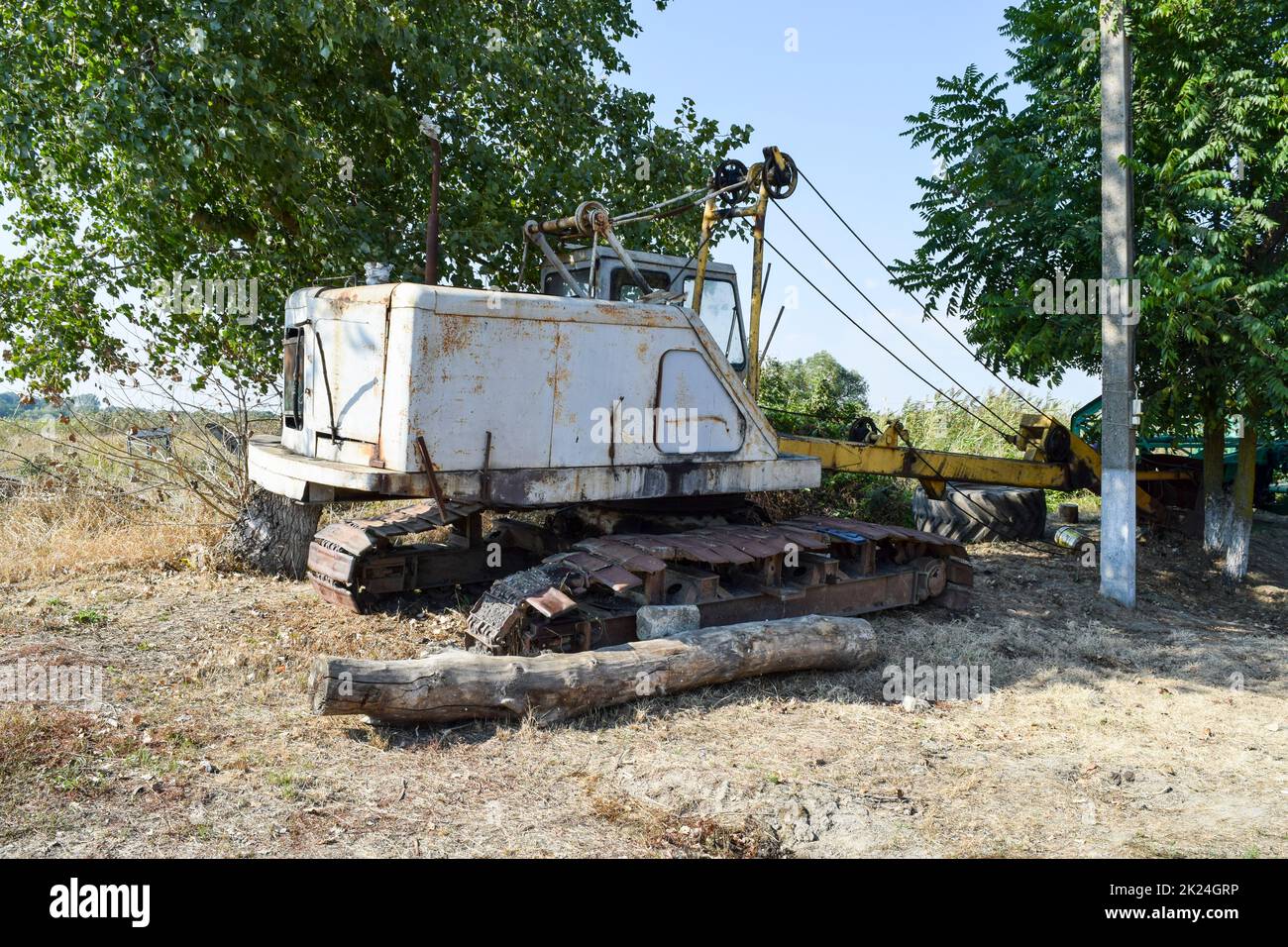 Old quarry near the dragline. Old equipment for digging the soil in canals and quarries. Stock Photo