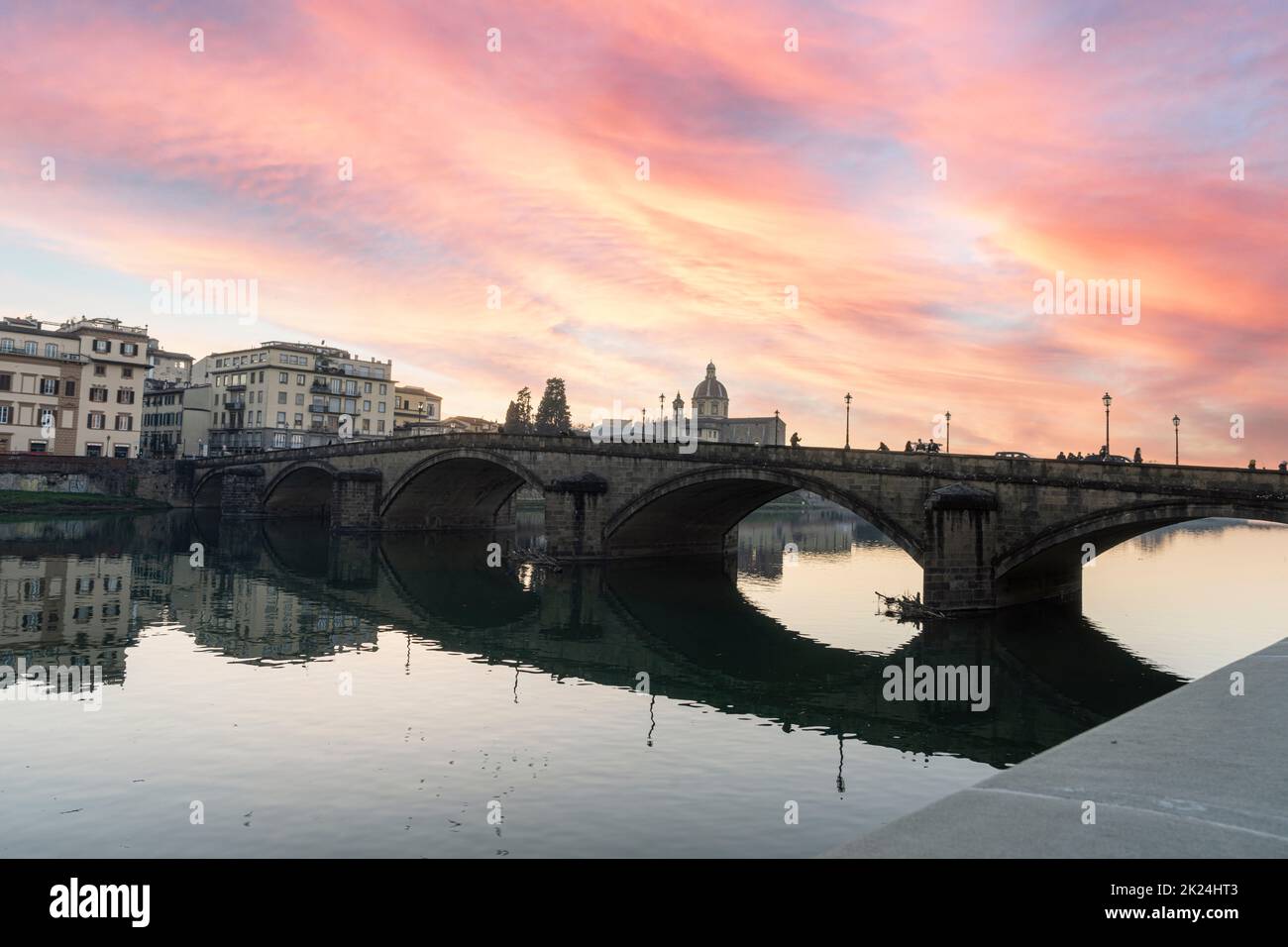 Florence, Italy. January 2022.  the view of the ponte alla Carraia bridge over the Arno river in the city center at sunset. Stock Photo
