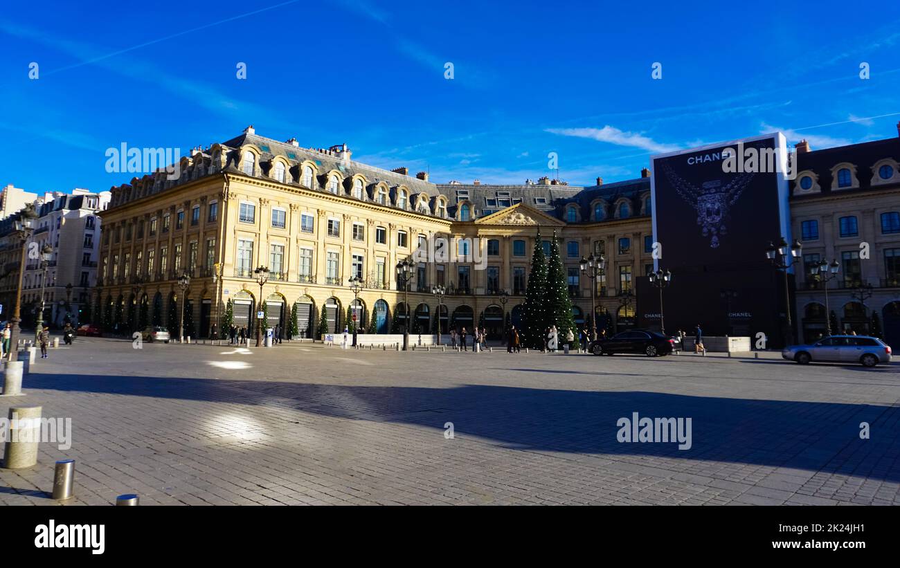 Paris, France - January 01, 2022: People going near Place Vendome, wich was laid out in 1702. The original Vendome Column at the centre of the square Stock Photo
