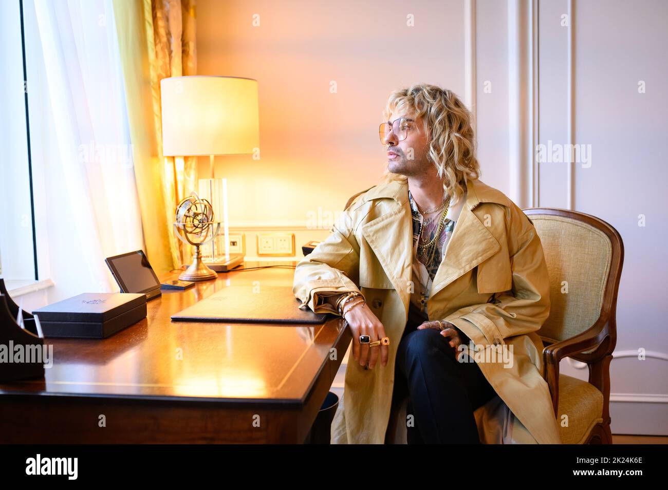 Hamburg, Germany. 22nd Sep, 2022. Tokio Hotel singer Bill Kaulitz sits at a desk in a suite at the Hotel Vier Jahreszeiten. Credit: Jonas Walzberg/dpa - ATTENTION: Use only in full format/dpa/Alamy Live News Stock Photo