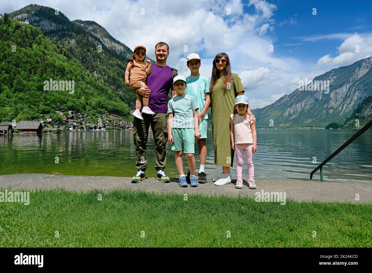 Portrait of family with four children over Austrian alps lake in Hallstatt, Salzkammergut, Austria. Stock Photo