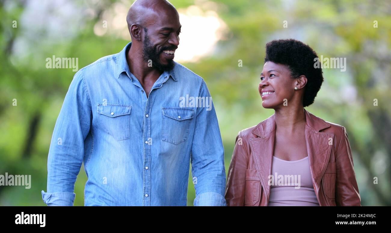 Happy African couple walking together outdoors Stock Photo - Alamy