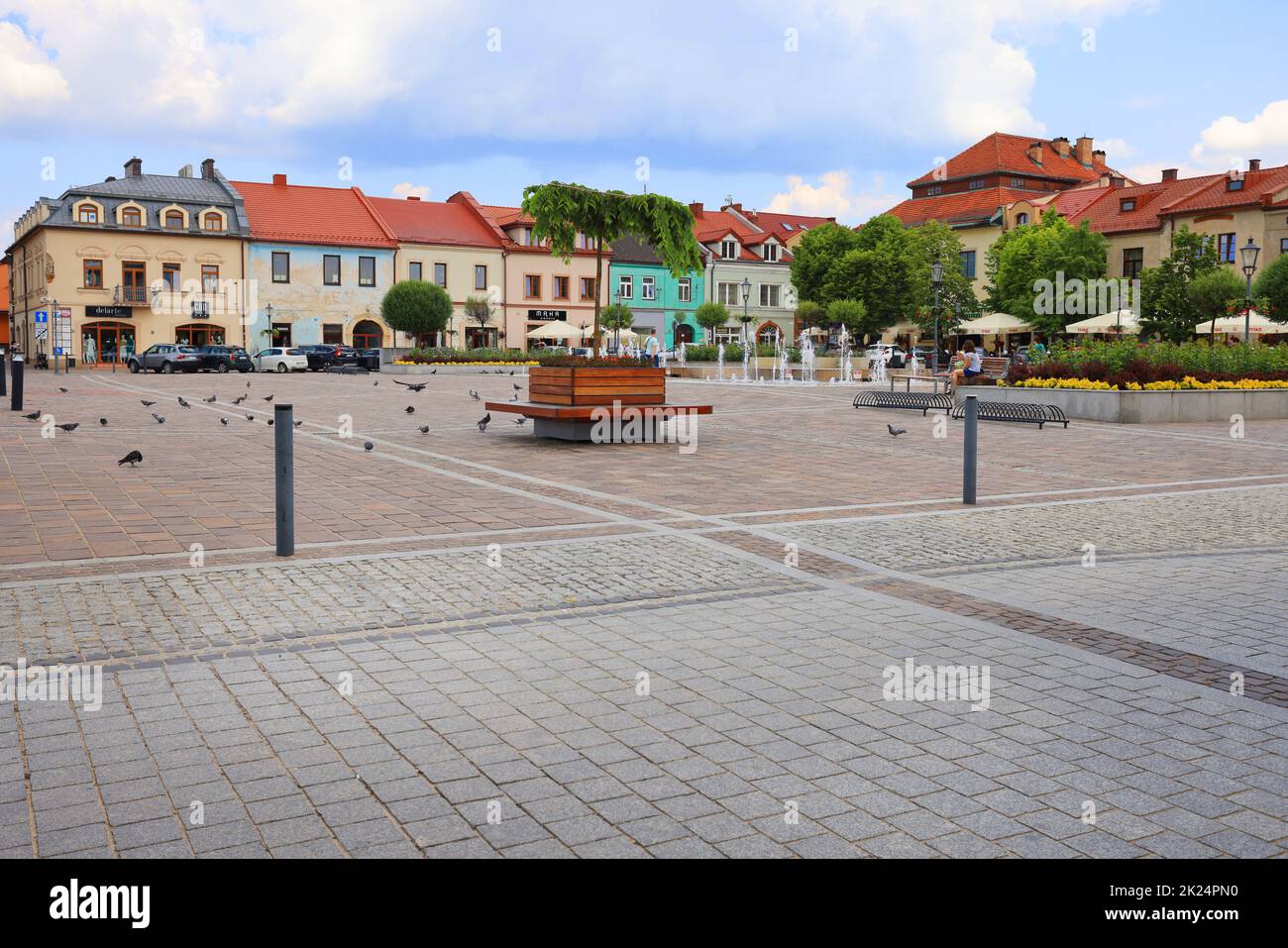 Olkusz, Poland - June 9, 2021: Market square in a small town near Krakow, colorful houses and a fountain Stock Photo