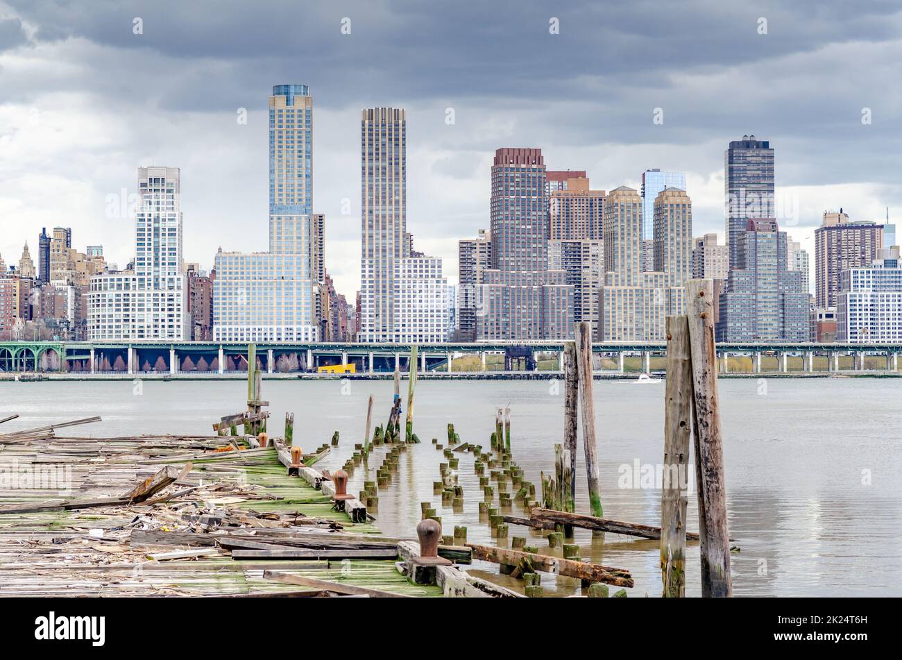 View of Manhattan Skyscrapers, New York City with wooden landing stage ...