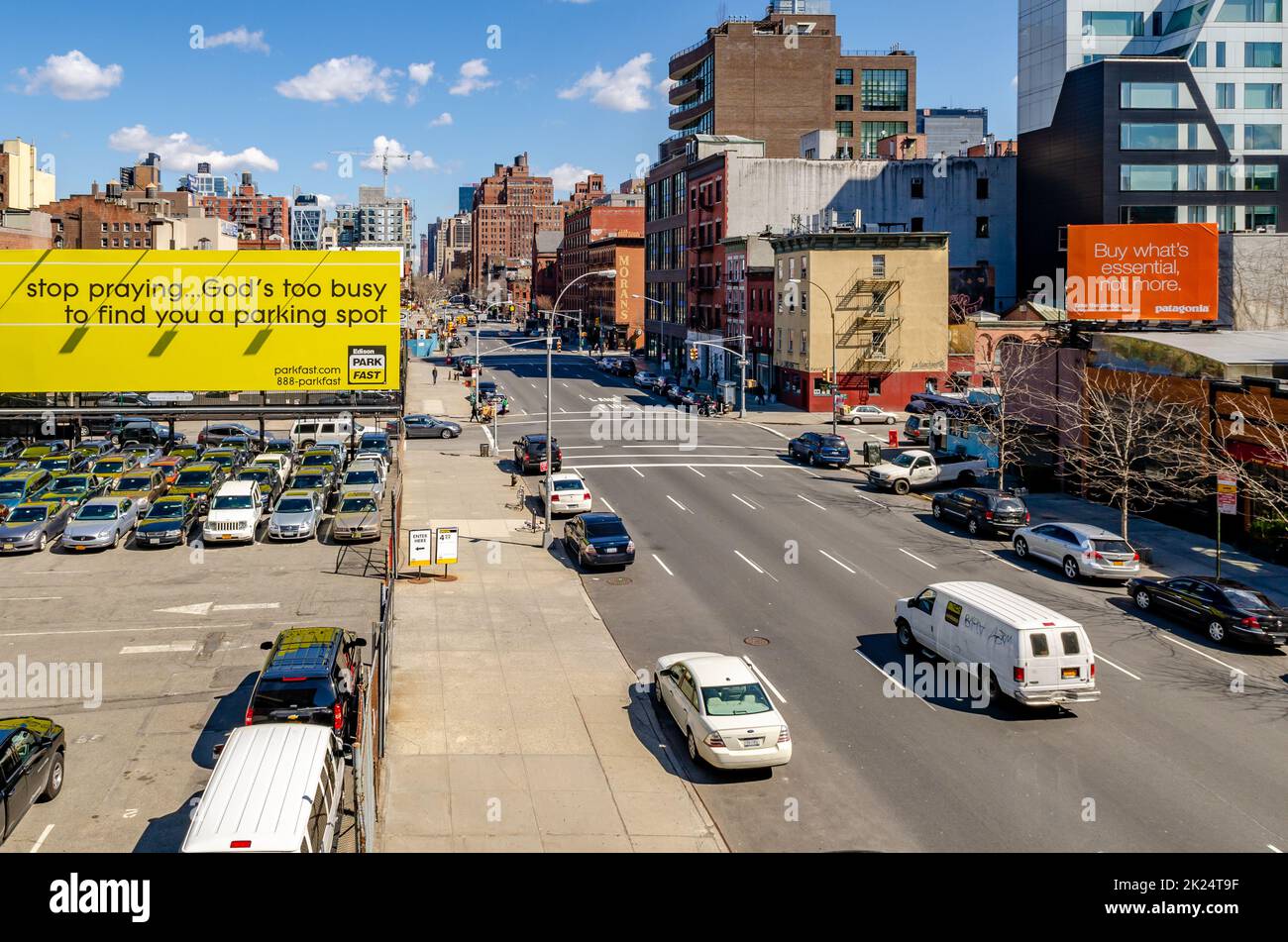City street in Chelsea with advertisement posters, traffic and lots of ...