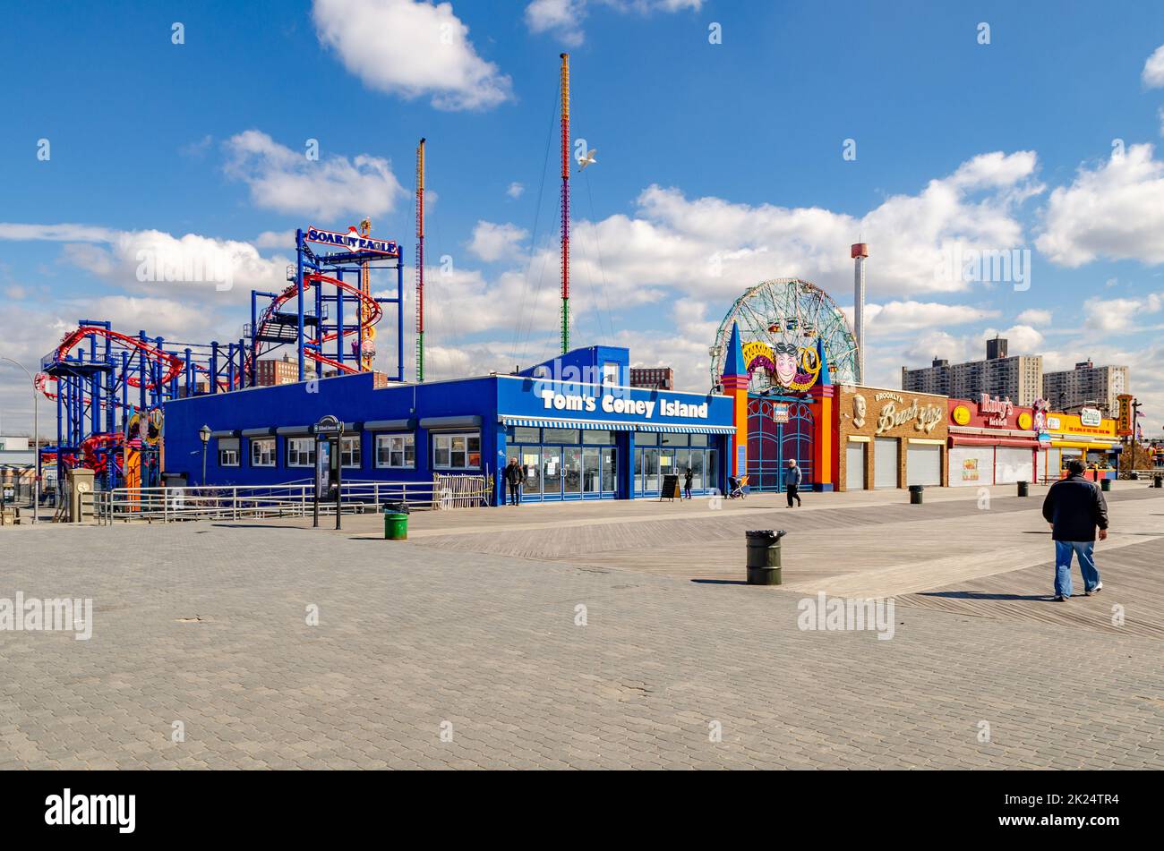 Tom's Coney island, Brooklyn Restaurant with Soarin' Eagle Rollercoaster, Wonder Wheel and Beach Promenade at Luna Park Amusement Park, Coney island, Stock Photo