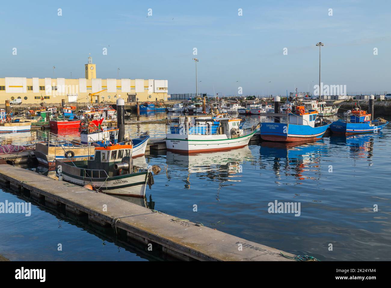 Sesimbra, Portugal - 13 March 2022: view of the harbor and village of Sesimbra in Portugal with colorful fishing boats Stock Photo