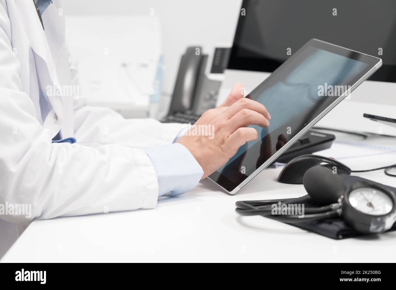 Doctor using his tablet computer at work. High quality photo Stock Photo