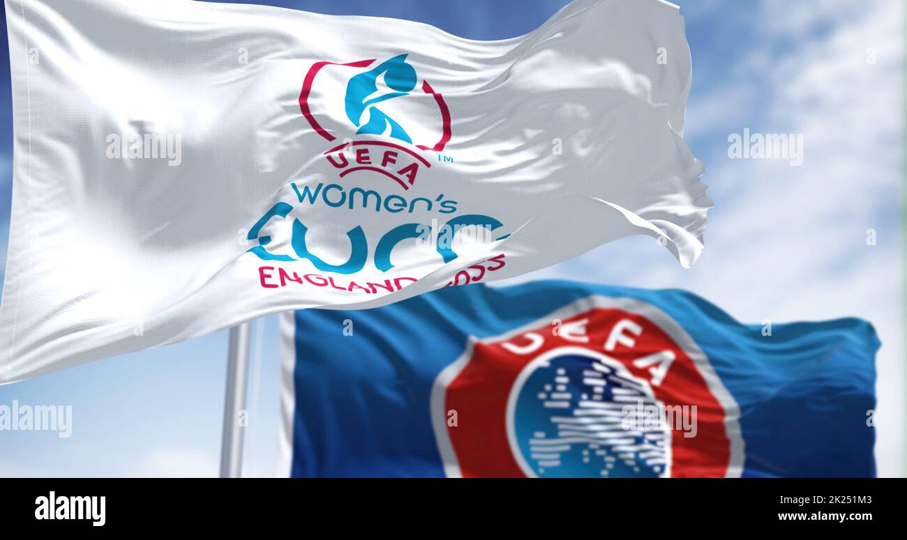 London, UK, May 2022: The flag of the UEFA European Women’s Football Championship Euro 2022 flying alongside the blurred UEFA flag. Women’s Euro 2022 Stock Photo