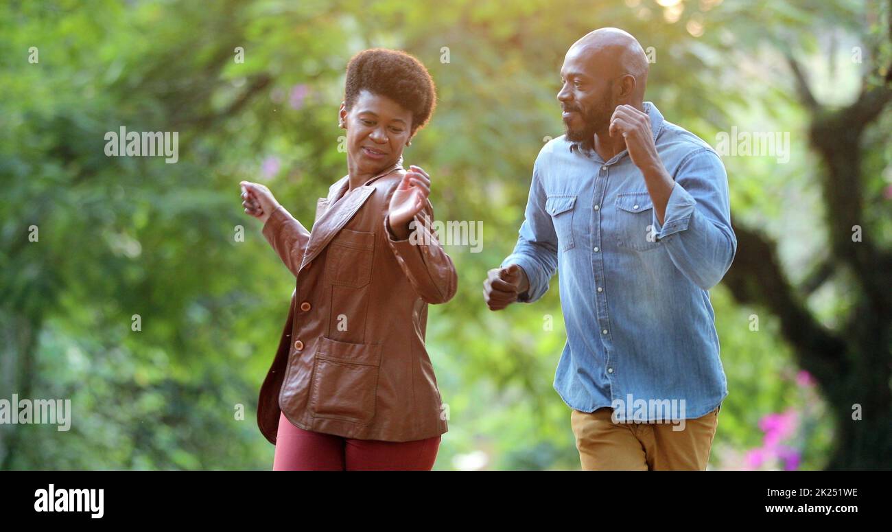 Happy African couple dancing outside celebrating Stock Photo - Alamy