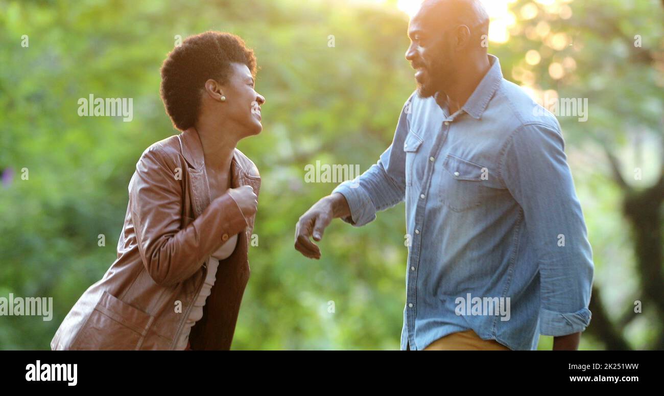 Happy African couple dancing outside celebrating Stock Photo - Alamy