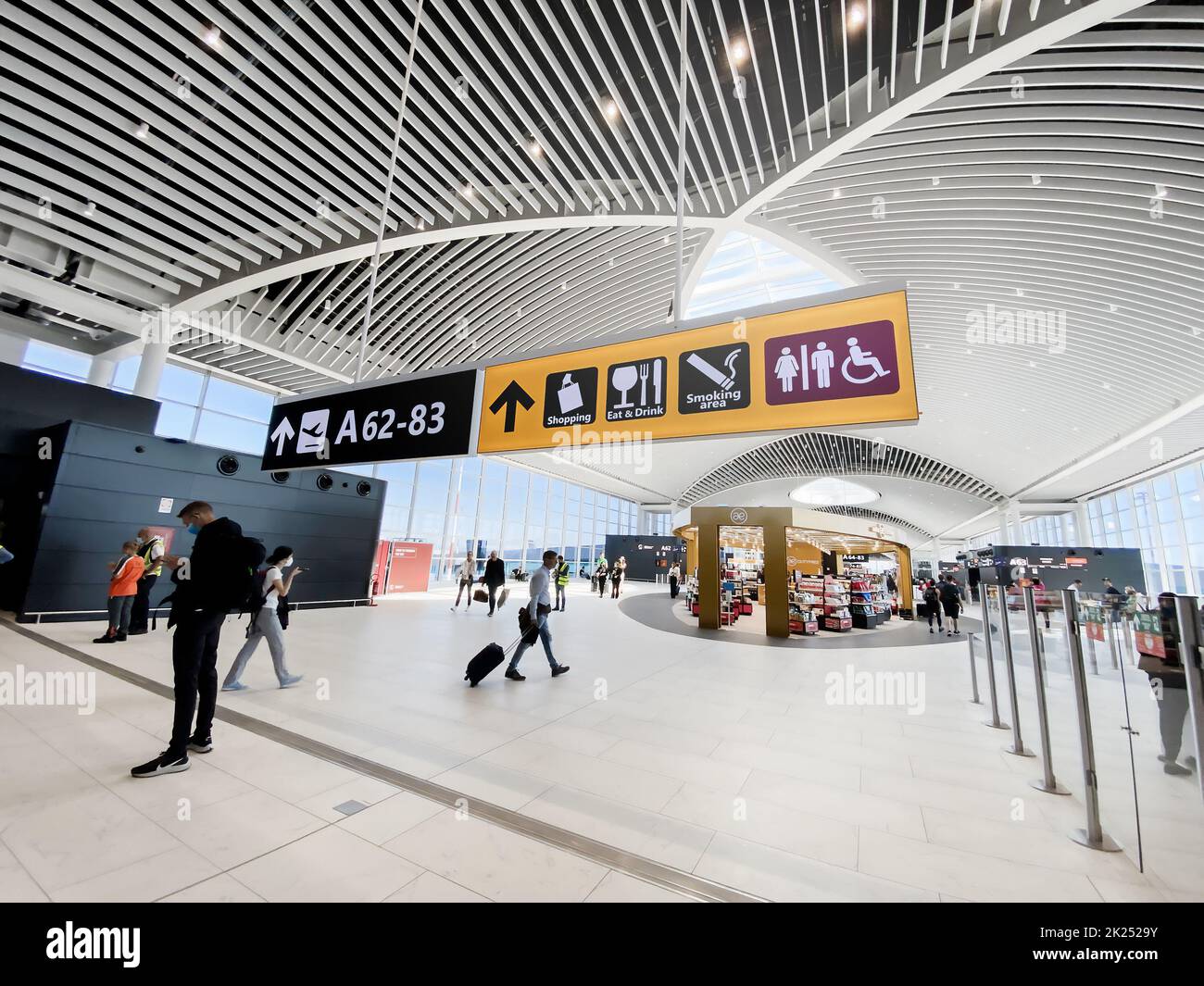 rome-italy-may-2022-people-walking-in-the-new-departure-hall-of