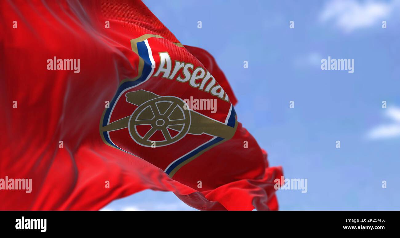 London, UK, May 2022: The flag of Arsenal Football Club waving in the wind on a clear day. Arsenal is a professional football club based in Islington, Stock Photo