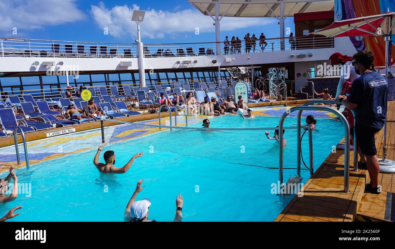 Miami, USA April 29, 2022 The people playing at pool at upper deck in mini volleyball at