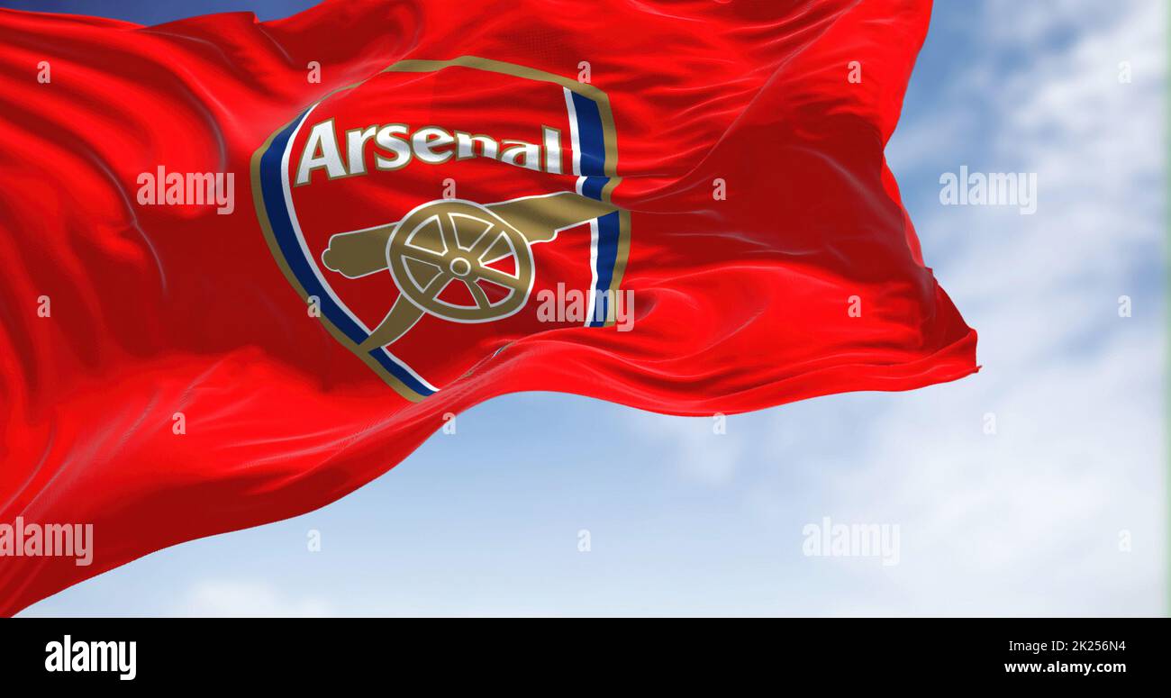 London, UK, May 2022: The flag of Arsenal Football Club waving in the wind on a clear day. Arsenal is a professional football club based in Islington, Stock Photo