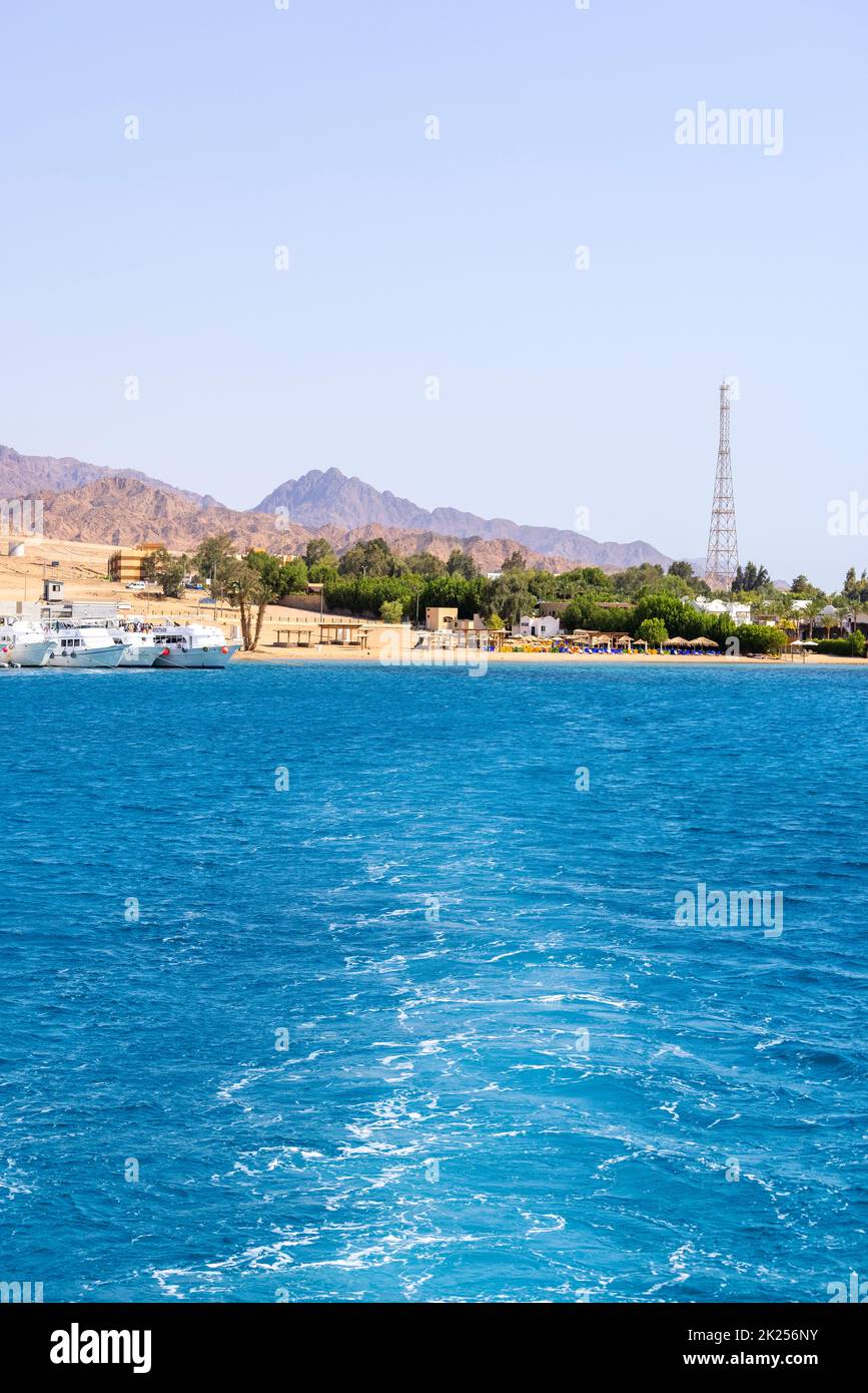 Dahab, Egypt - September 10, 2021: View of dive boats moored in the port. Dahad is a former Bedouin village surrounded by mountains, now one of the m Stock Photo