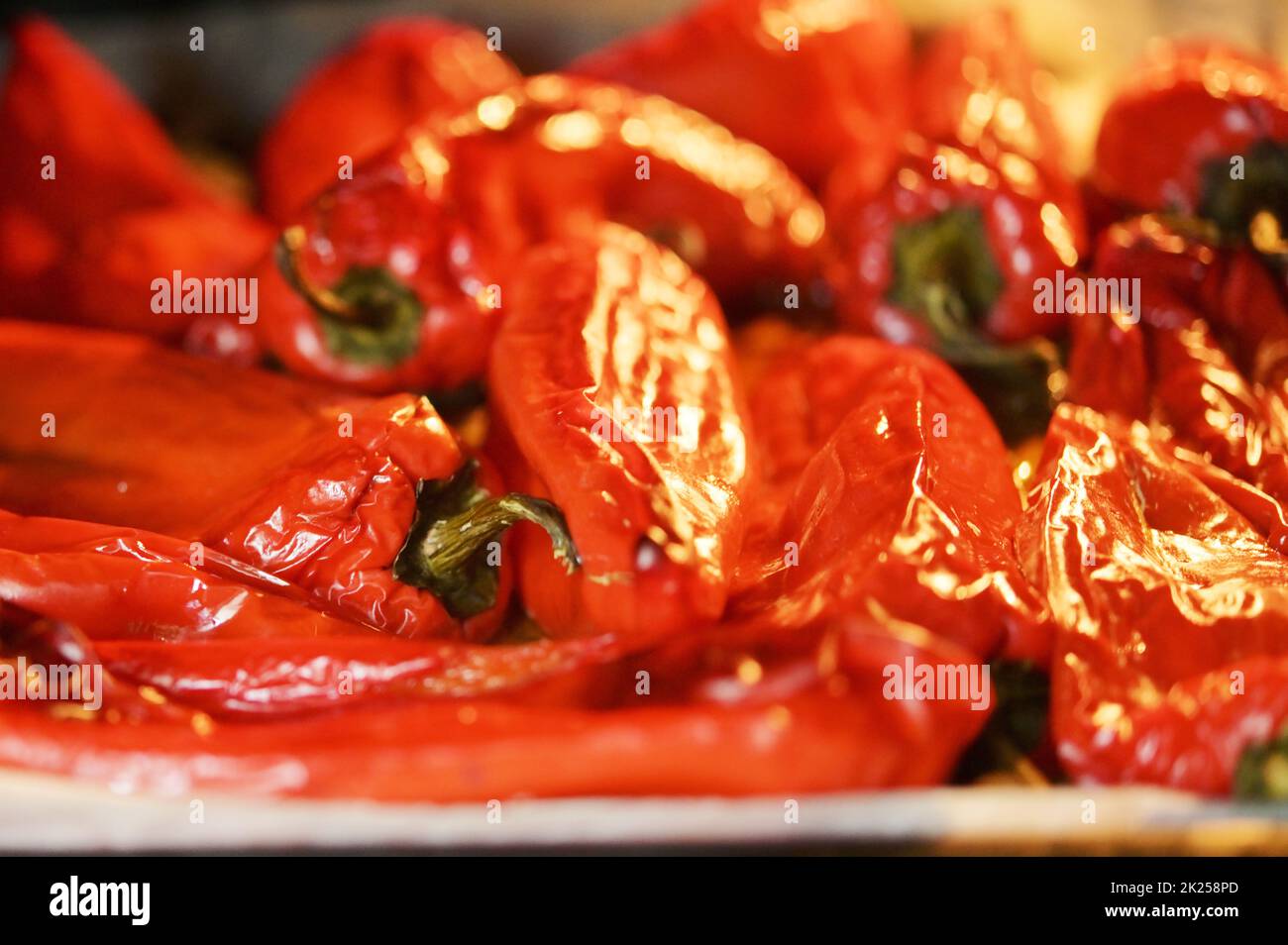 Red tasty peppers roasted in oven Stock Photo