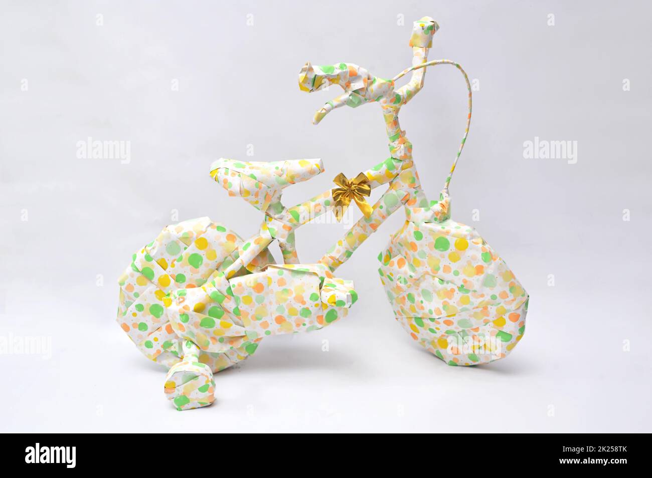 Fun Secret Gift. Bike with Wheels In Playful Gift Wrap Stock Photo