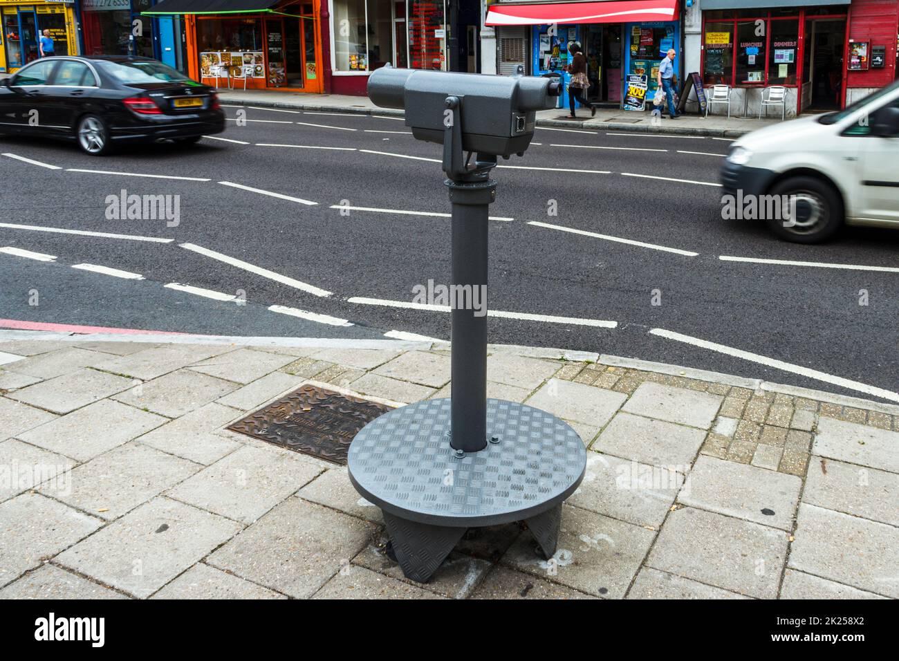 Public use telescope in Holloway Road, part of an artwork entitled 'how to make Archway Tower disappear', London, UK Stock Photo