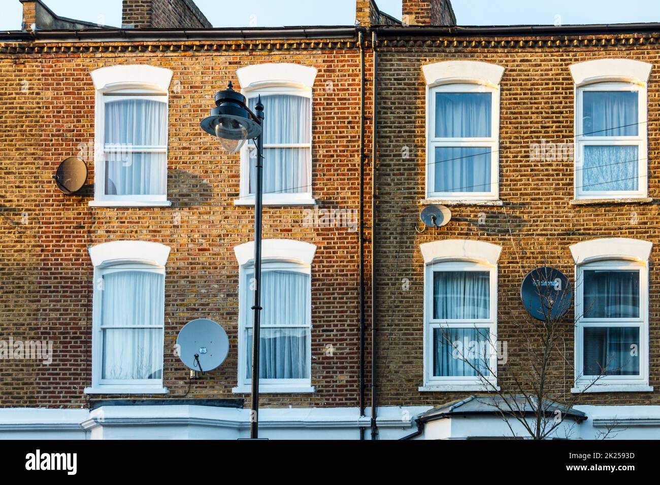 Satellite dishes, unlawfully placed on the exterior of properties in a conservation area in Islington, London, UK Stock Photo