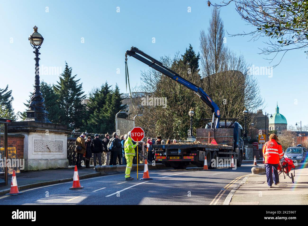 Local campaigners and council officers watch as a sample anti-suicide fence panel is installed on Hornsey Lane bridge in North London, UK Stock Photo