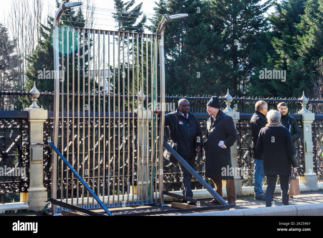 Local campaigners and council officers watch as a sample anti-suicide fence panel is installed on Hornsey Lane bridge in North London, UK Stock Photo