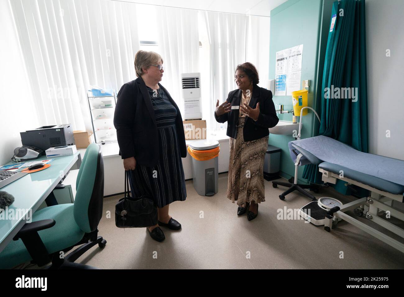Health and Social Care Secretary Therese Coffey (left) speaks to Dr Sheila Neogi during her visit to The Marven Surgery in London, following her announcement to help patients receive easier access to NHS and social care. Issue date: Thursday September 22, 2022. Stock Photo