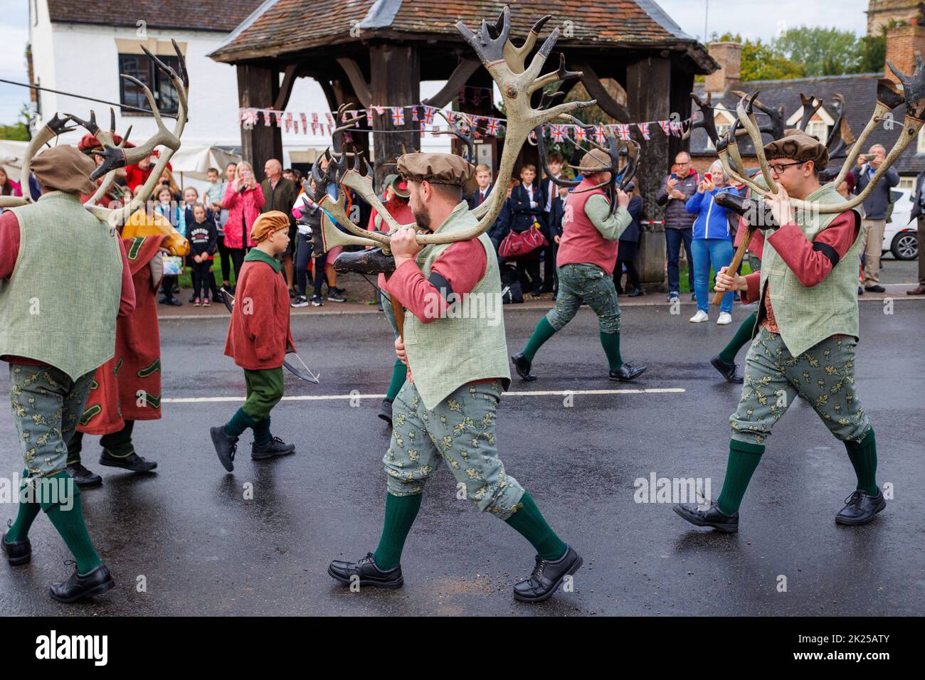 The Annual Abbotts Bromley Horn Dance. Pictured, the deer-men dancing infront of the market place in Abbotts Bromley. The folk dancers remove the horns from the walls of St Nicholas Church at 8am and proceed to dance all day visiting nearby villages, returning the horns for another year to the chuch walls at 8pm. A blessing service at 7am takes place led by Revd Simon Davis.in 2022. The horn dance has been taking place since the 12th century. Stock Photo