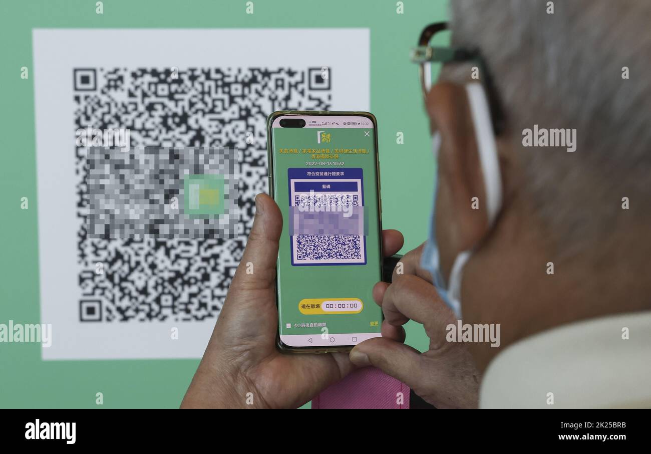 Visitors scan the QR code in the Leave Home Safe app as they visit the