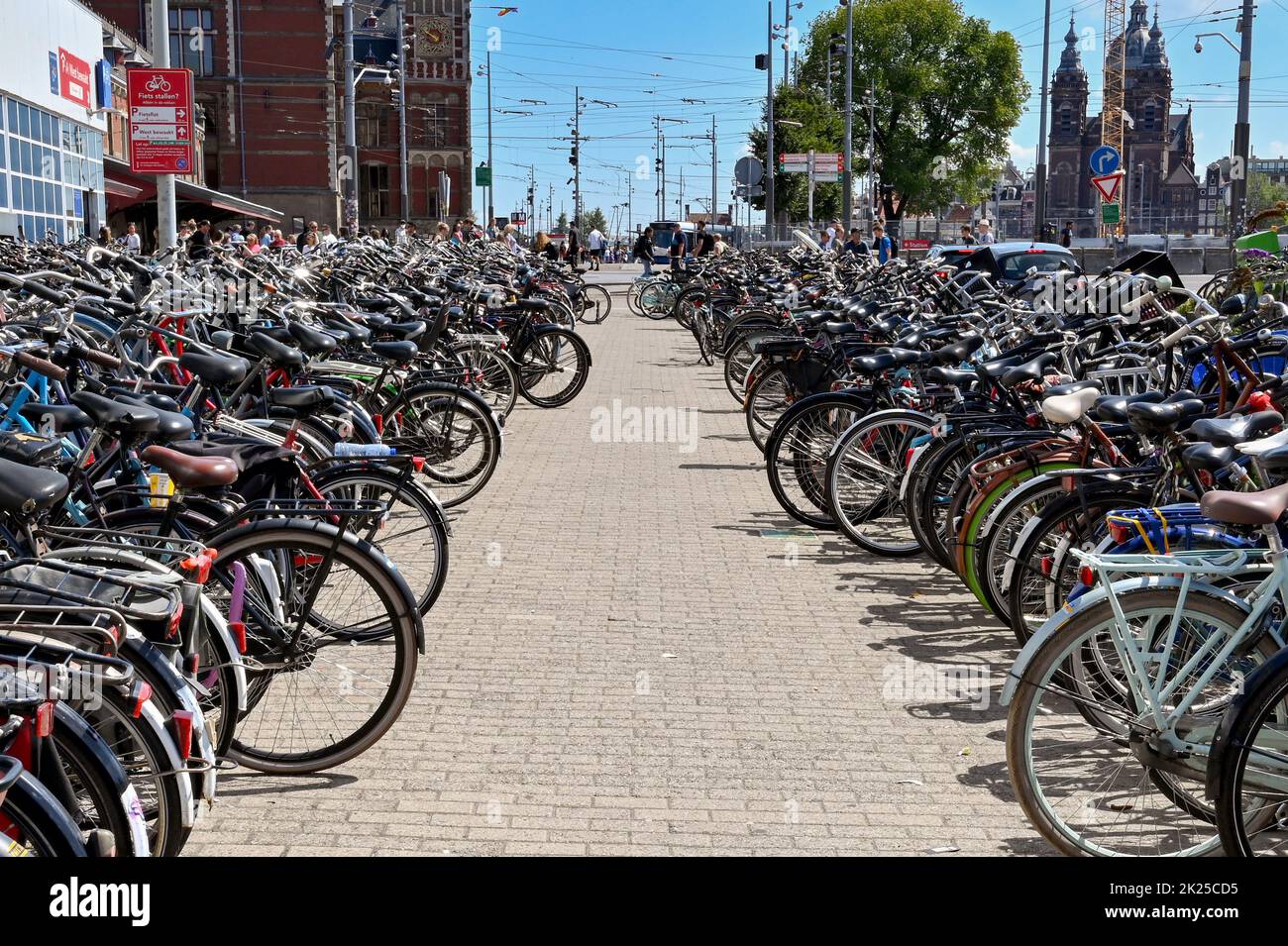 Amsterdam, Netherlands - August 2022: Rows of bicycles in bicycle racks left by commuters n the city centre Stock Photo