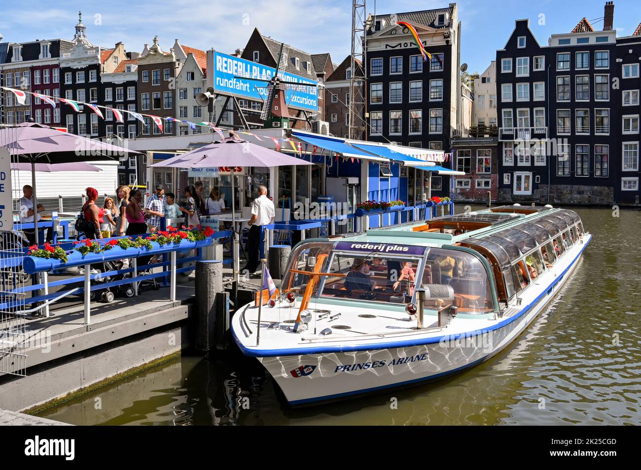 Amsterdam, Netherlands - August 2022: Tourist sightseeing canal boat moored at one of the piers in the city centre Stock Photo