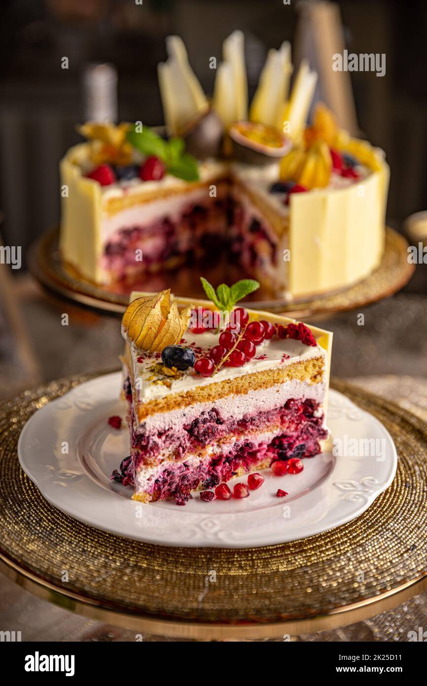 Portion of layered creamy fruit cake Stock Photo