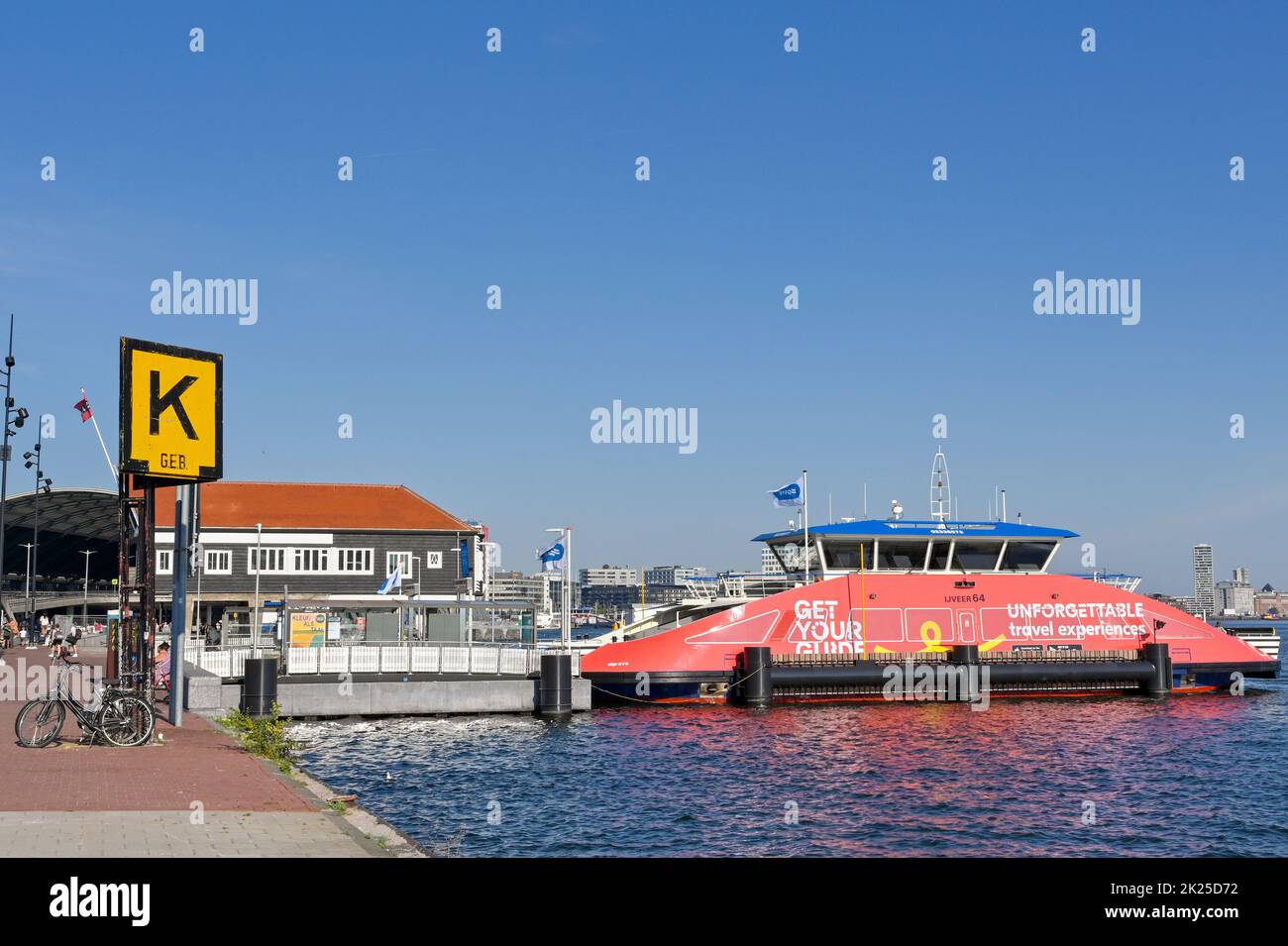 Amsterdam, Netherlands - August 2022: Passenger ferry mooored on the waterfront in Amsterdam Stock Photo