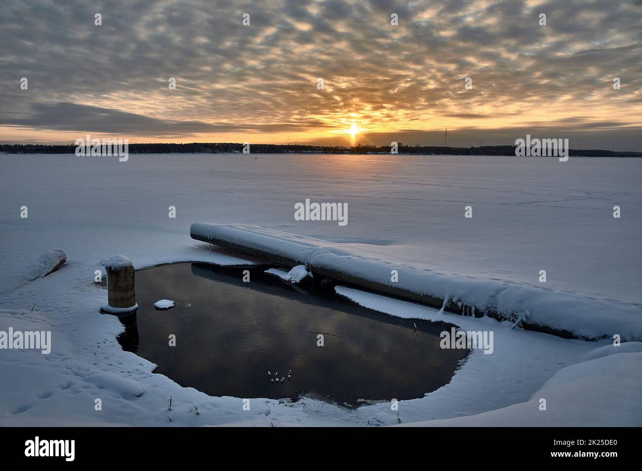 Winter sunset on the river in the month of January Stock Photo